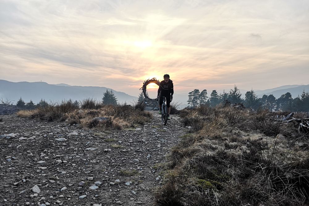 Cycling the Great Glen Way Cyclist on the Great Glen Way near Viewpoint sculpture
