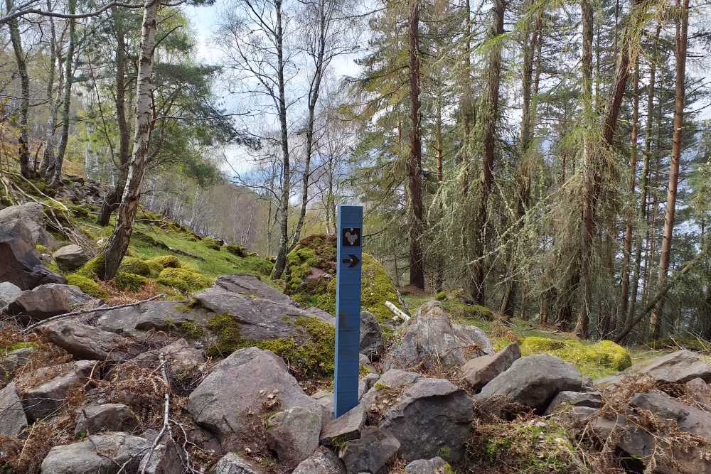 On the South Loch Ness Trail Waymarker on the South Loch Ness Trail with Loch Ness in the background