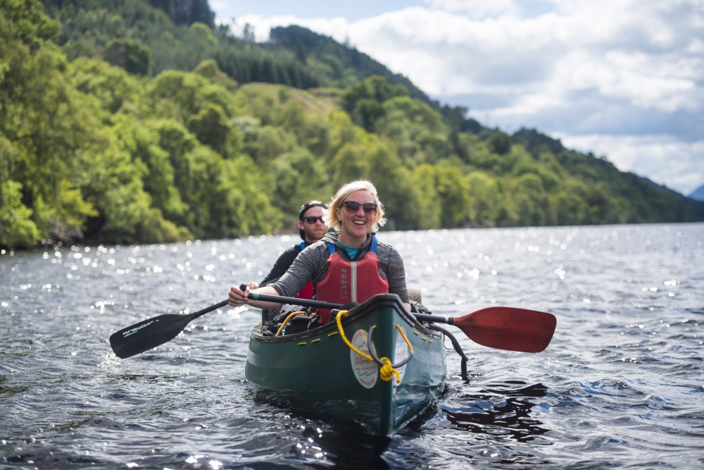 Two people canoeing on Loch Ness with In Your Element