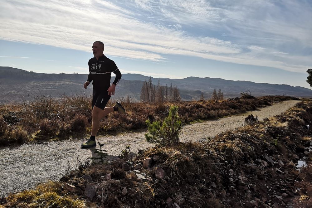 Runner on the Loch Ness 360° Trail Runner on the Loch Ness 360° Trail, trailrunning in Scotland