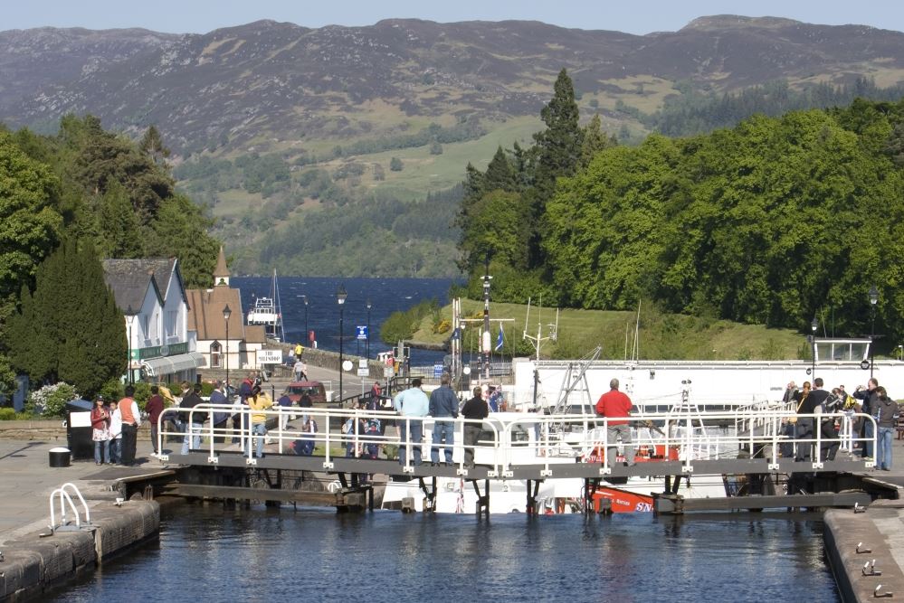 People standing on a Caledonian Canal key at Fort Augustus