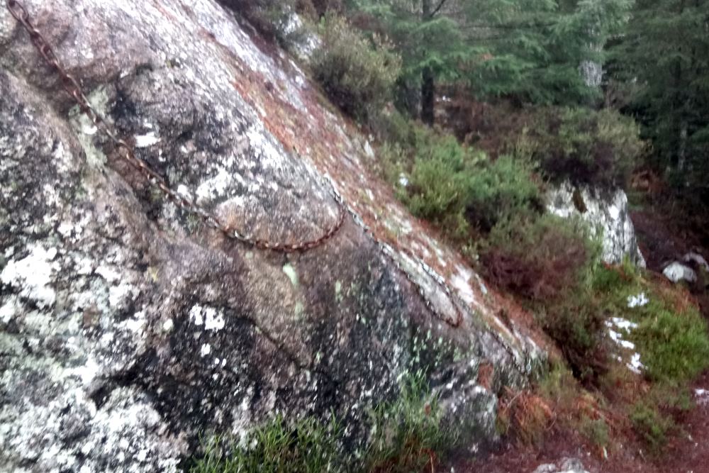 Chains on a rock on the South Loch Ness Trail to help walkers get across a steep section