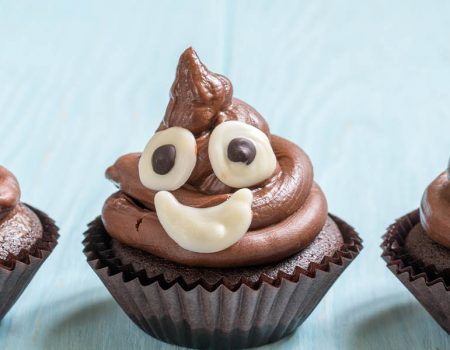 Smiling faeces - cupcakes made to look like poo emojis