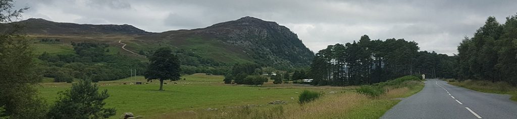 A road winding through the highlands of Scotland
