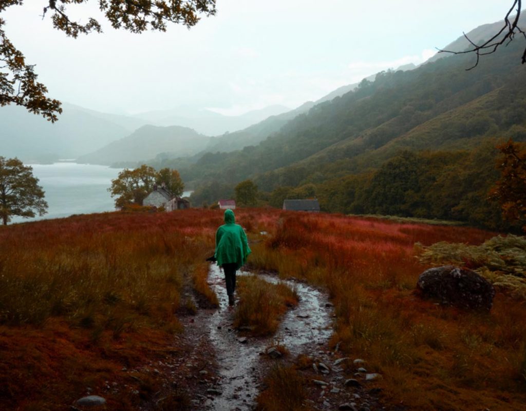 A hiker walking in the rain in the beautiful Scottish Highlands.