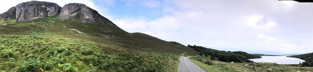 A view along a track in the Highlands by a loch.