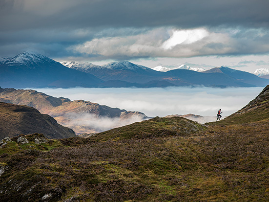 a runner in the hills of Scotland