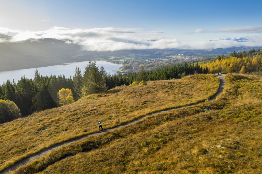 Running along path with Loch Ness in background