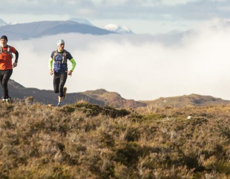 Two men running near Loch Ness
