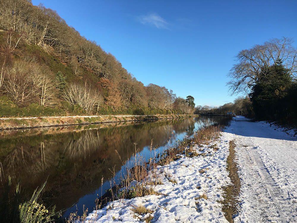 Th Caledonian Canal on a winters day with a snow covered path