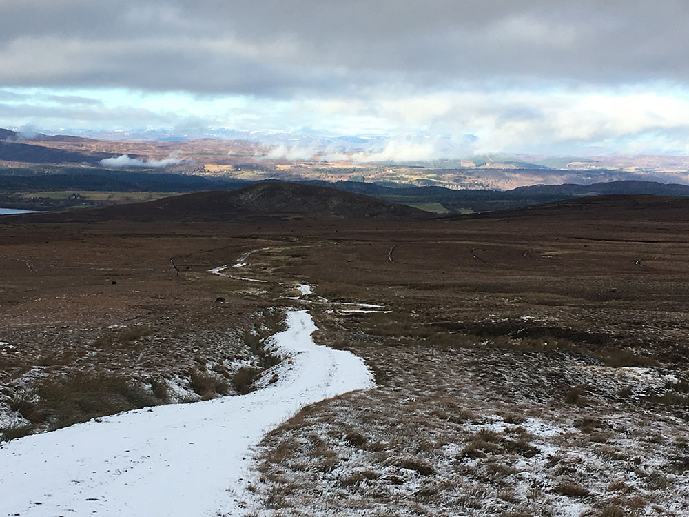 The Loch Ness 360 trail with snow on the path