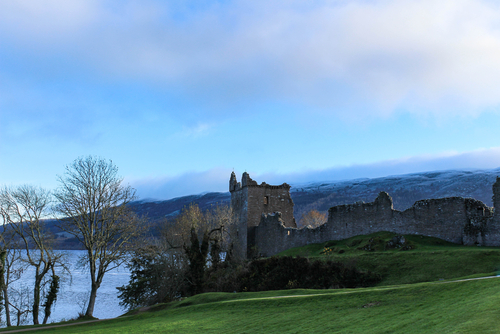 Urquhart Castle with snowy hills in the background