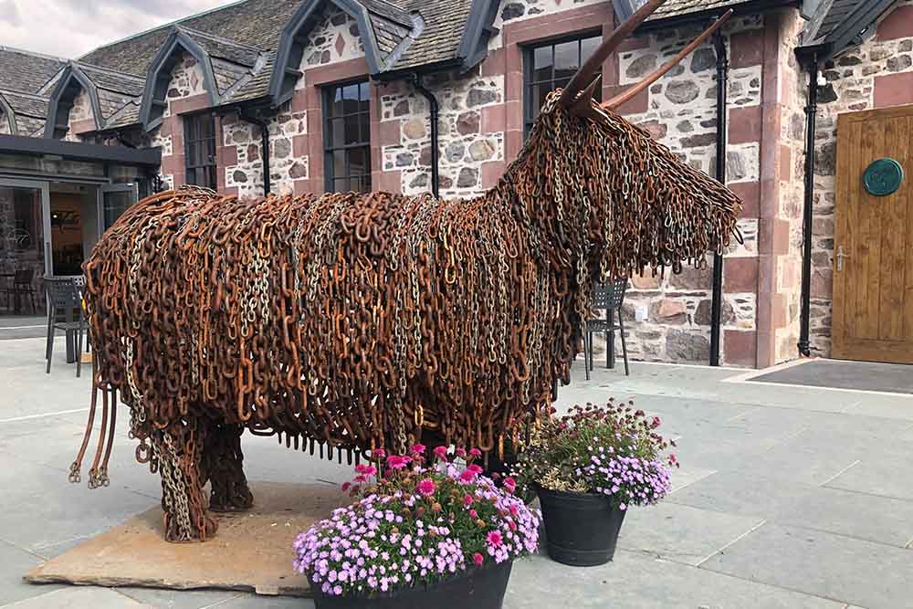 A Highland Cow made of chains at An Talla by Loch Ness